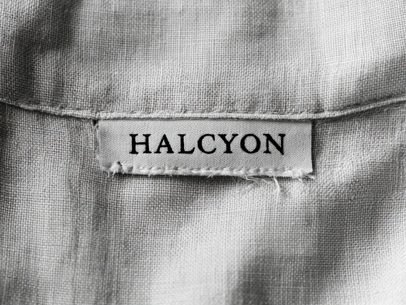 Halcyon — a woven label stitched inside the collar of a linen garment